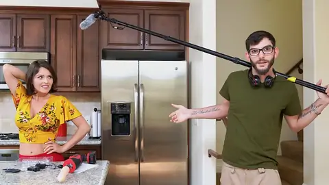 Preparing to pummel the chocolate-colored-haired babe with a machine